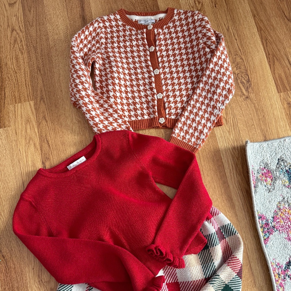 2 outfits- orange and white sweater & a sweater/skirt set